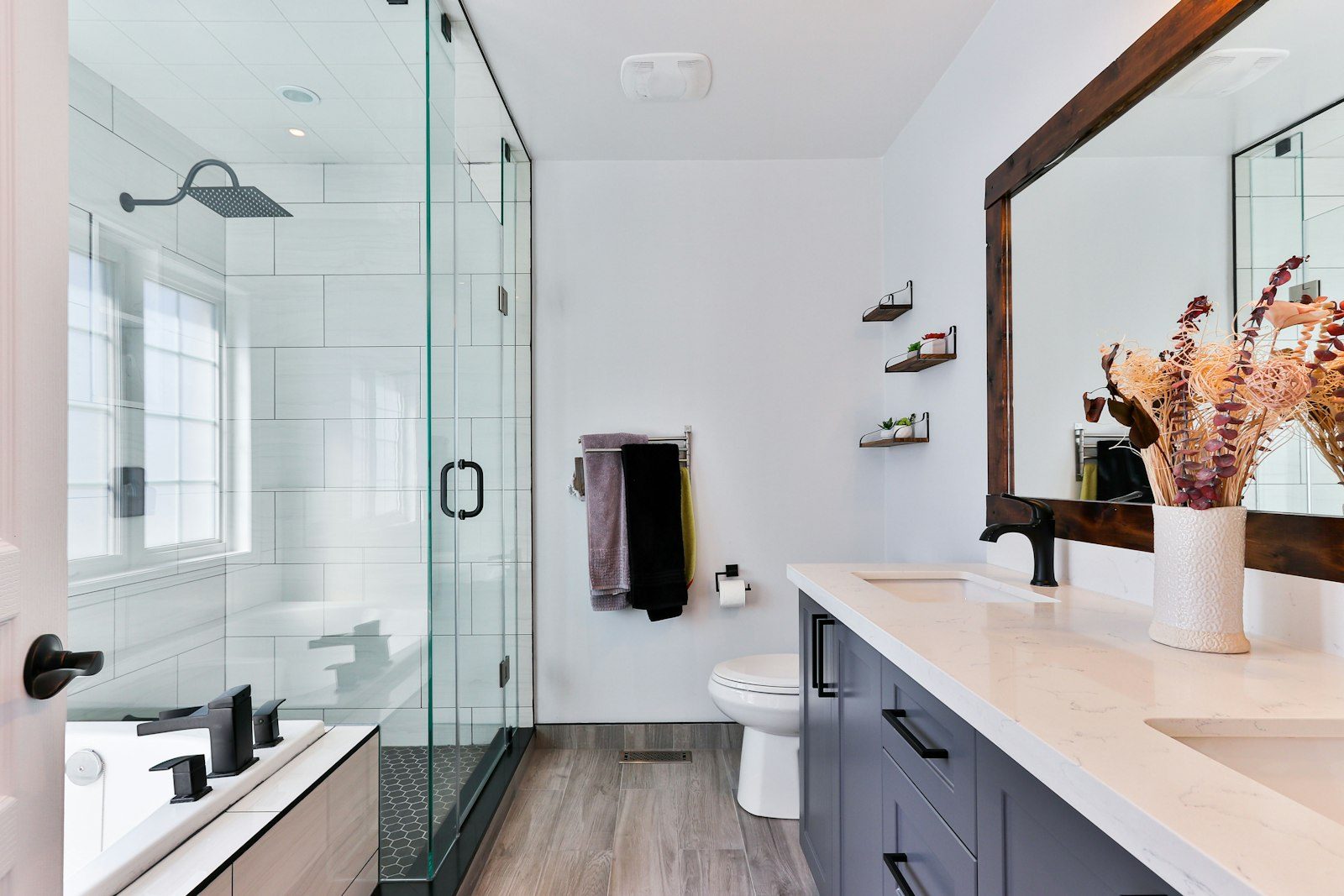 Modern bathroom with walk-in shower and dual vanity